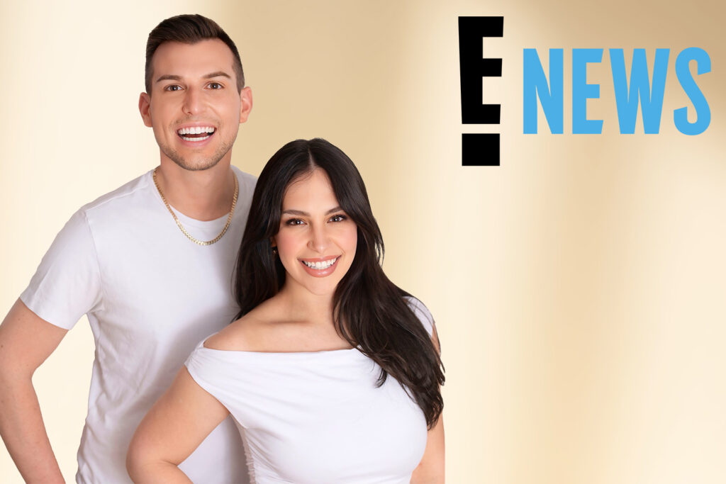 Two people in white shirts smiling in front of a beige background with the "E! NEWS" logo in the top right corner. The man, Matt Fraser, is pictured alongside another person.